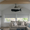 Black wooden whale wall art nautical decor in beach house sun room coastal living room by Haven America