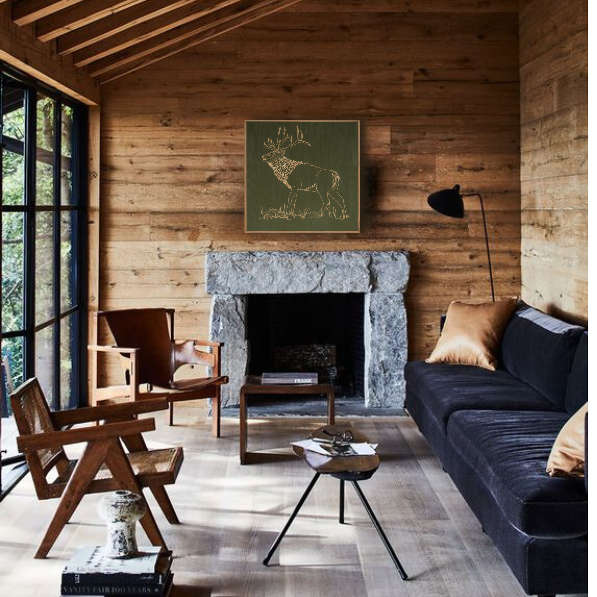 Cozy living room with wooden walls, a fireplace, and modern furniture featuring a carved elk artwork