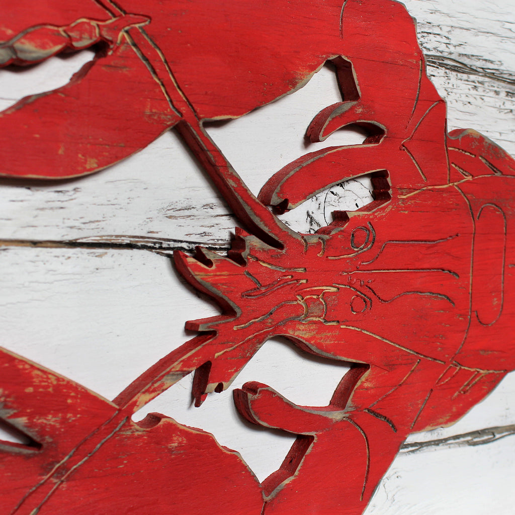Close-up detail of Dockside Lobster Plaque showing the hand-carved Barnwood Red lobster and distressed rustic wood texture