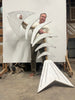 Artist gregory morris standing holding a 90