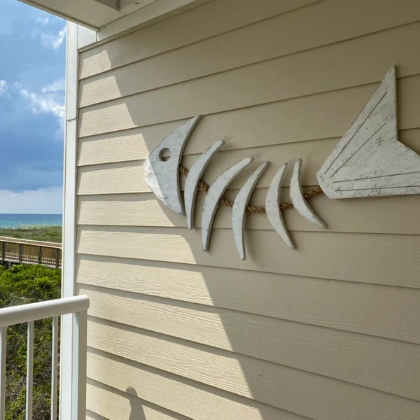 White Rope Fish wall art on a house exterior with ocean view
