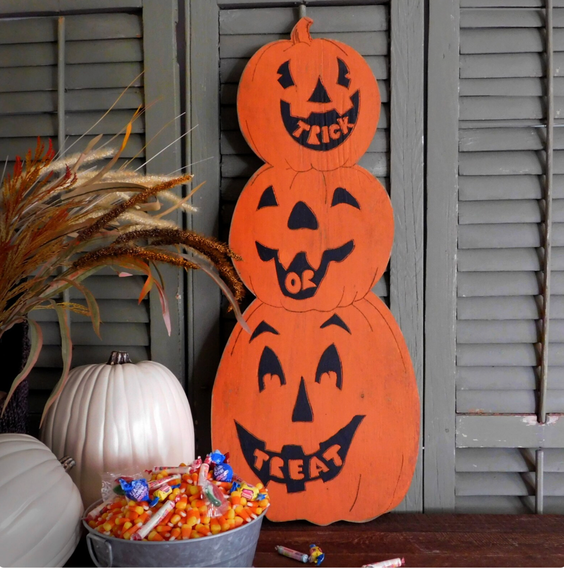 Trick or Treat Pumpkin Stack artworks sits next to a candy bowl in a company break room as halloween decor