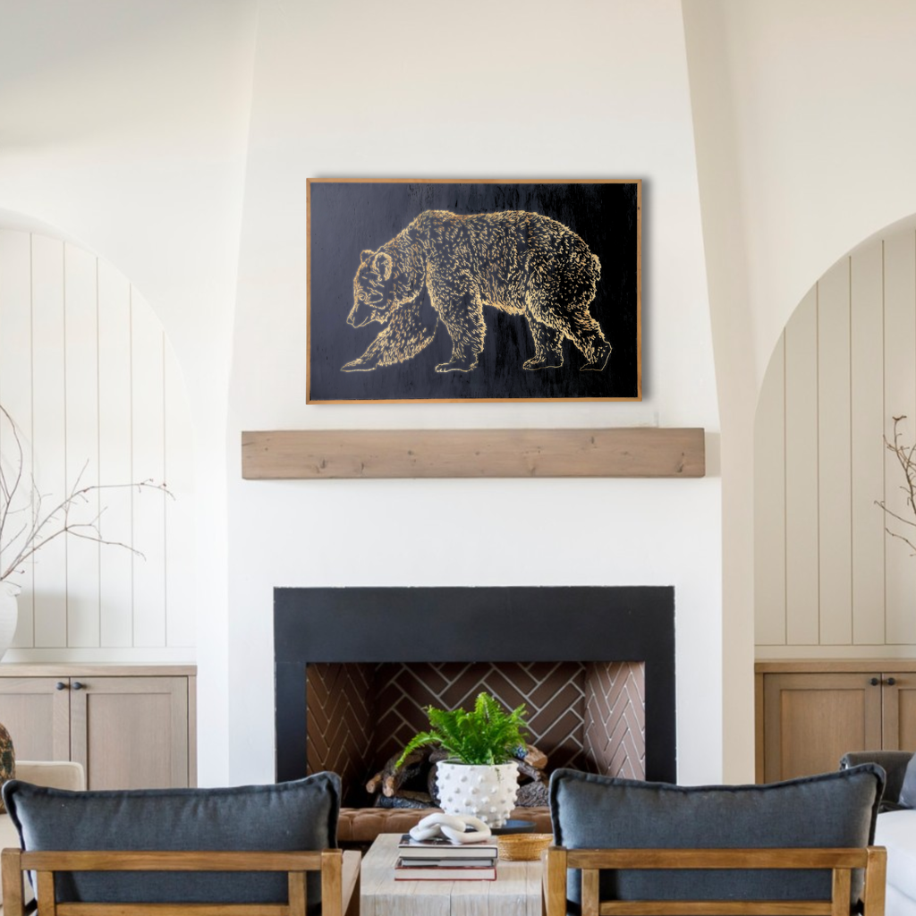Carved Bear artwork in color, cast iron black placed over a living room fireplace