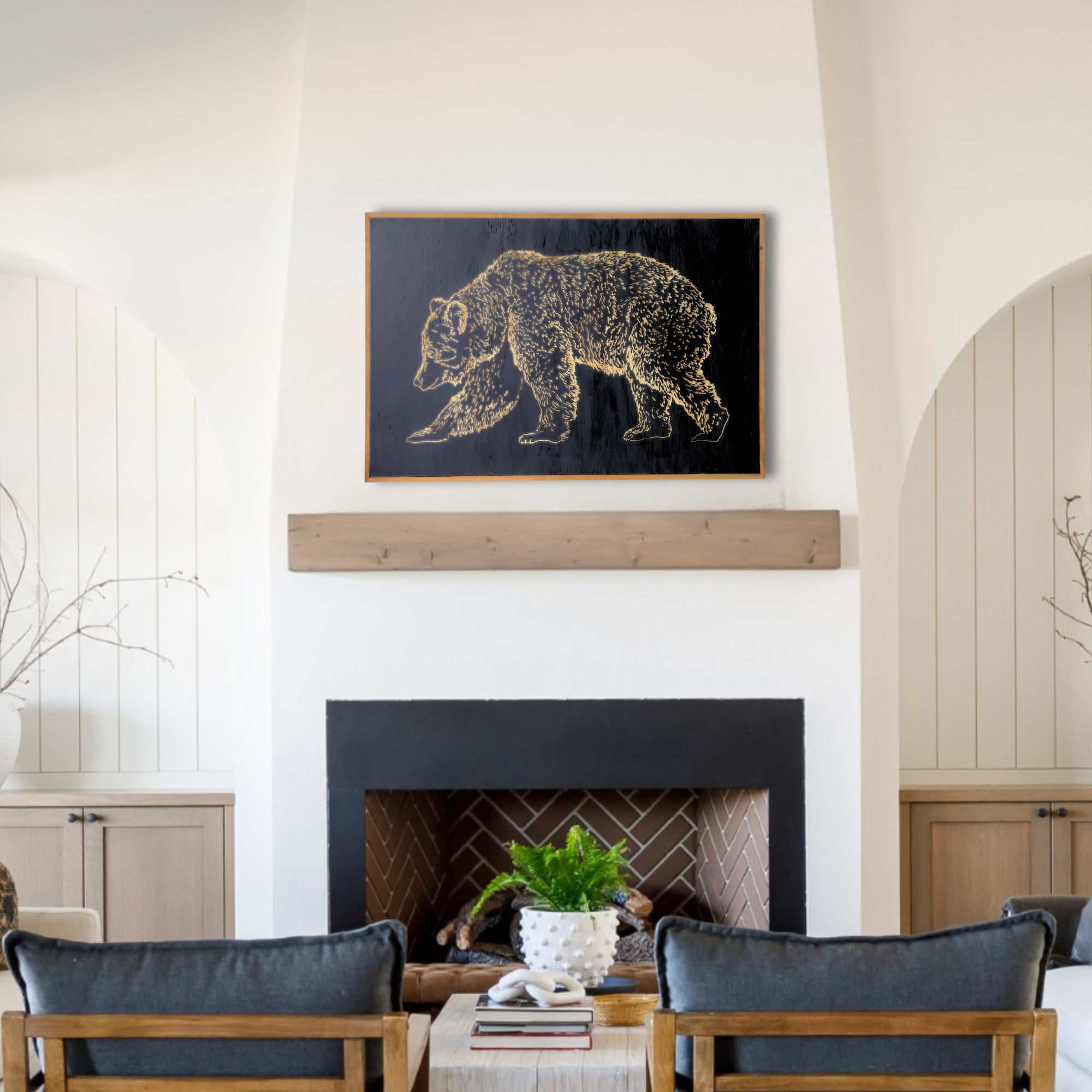 Carved Bear artwork in color, cast iron black placed over a living room fireplace