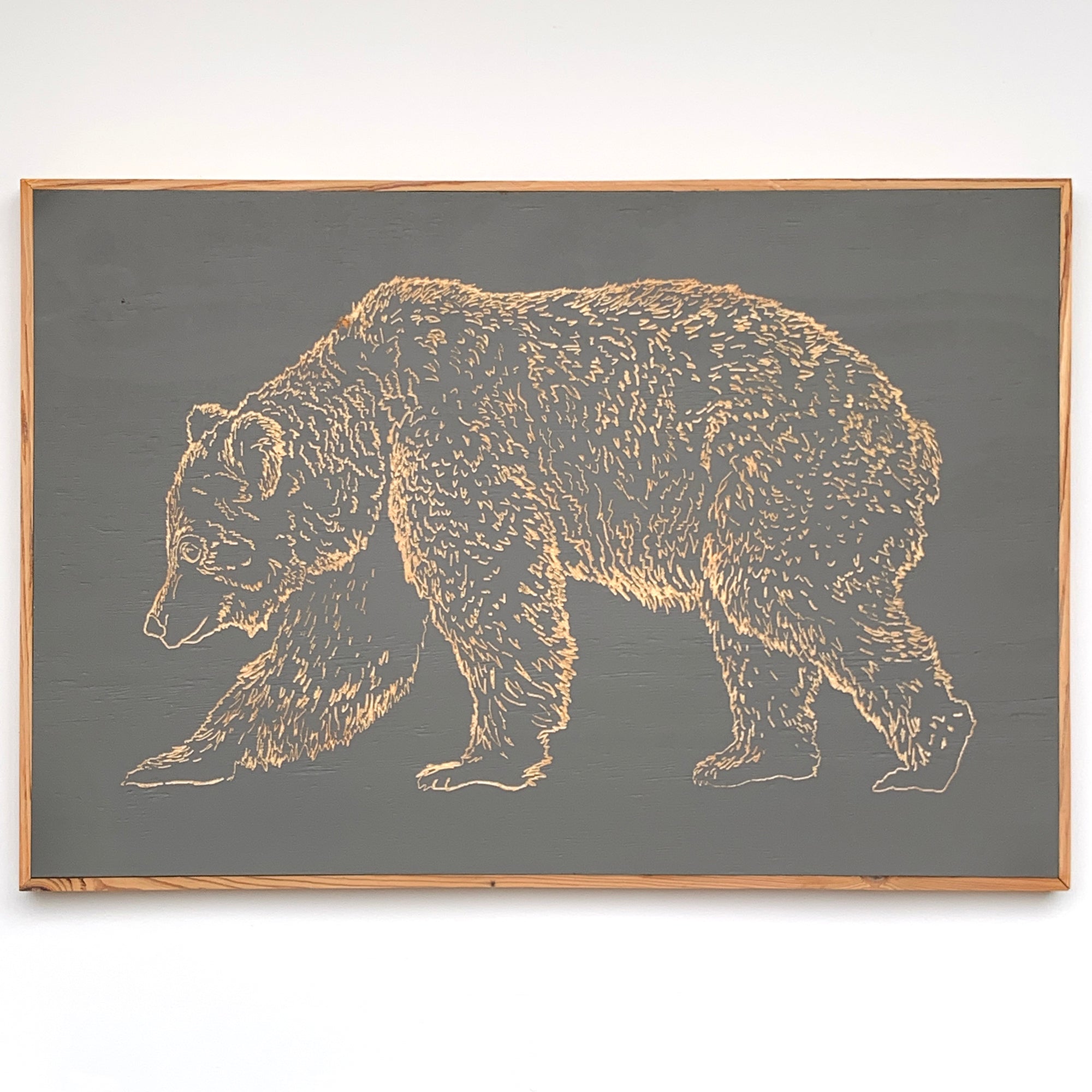 Carved wooden bear framed wall art in natural wood and painted finish