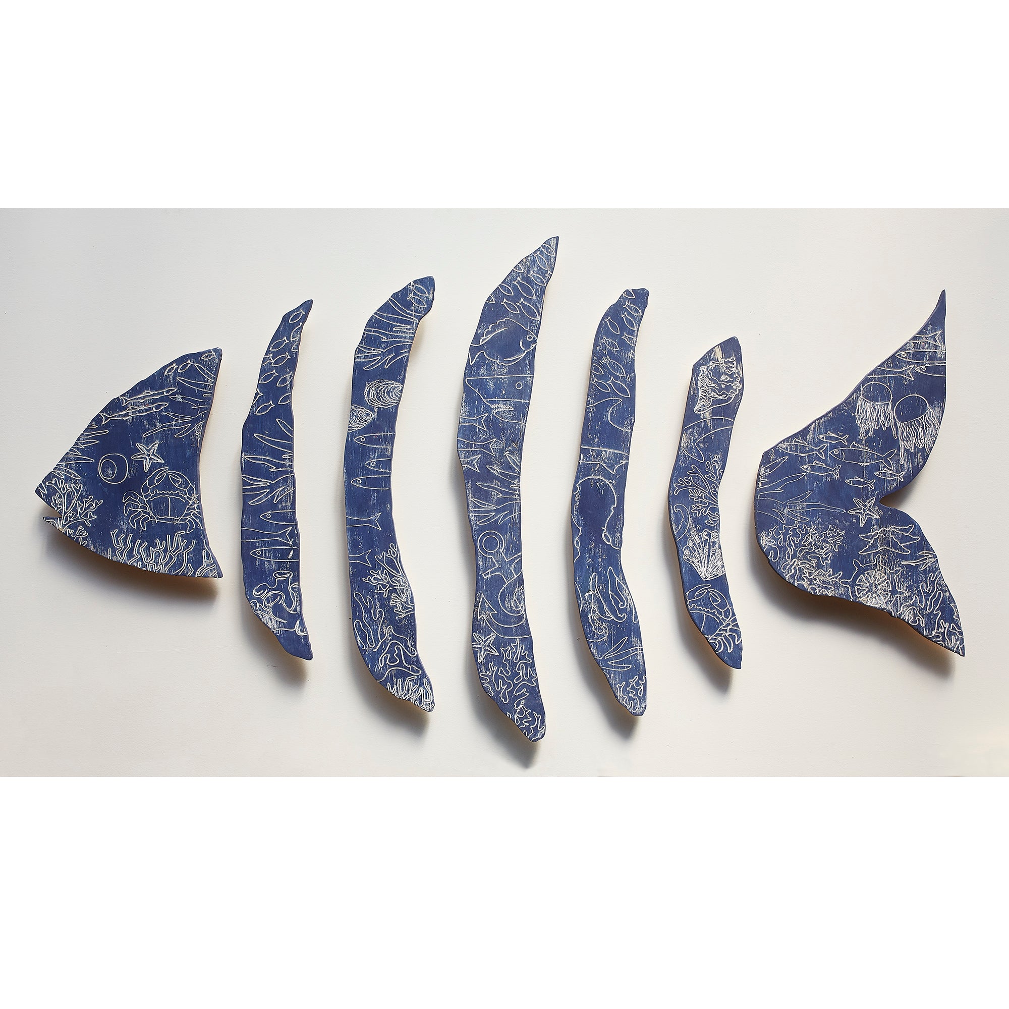 Ocean Bone Fish carved wooden wall art by Haven America, handcrafted multi-piece fish sculpture available in custom colors.