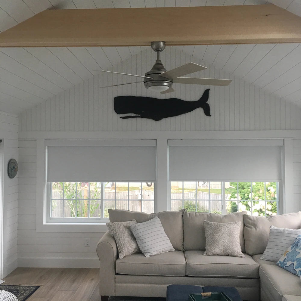 Folk Whale placed over a living room sofa