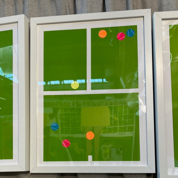 photo of tennis court print with colorful tennis balls laying on the court