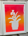 orchid flower vase in pink, yellow, and orange