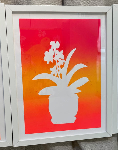 orchid flower vase in pink, yellow, and orange