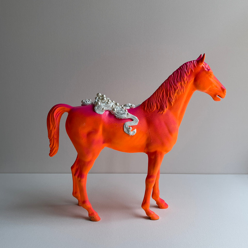 opposite profile of large horse sculpture